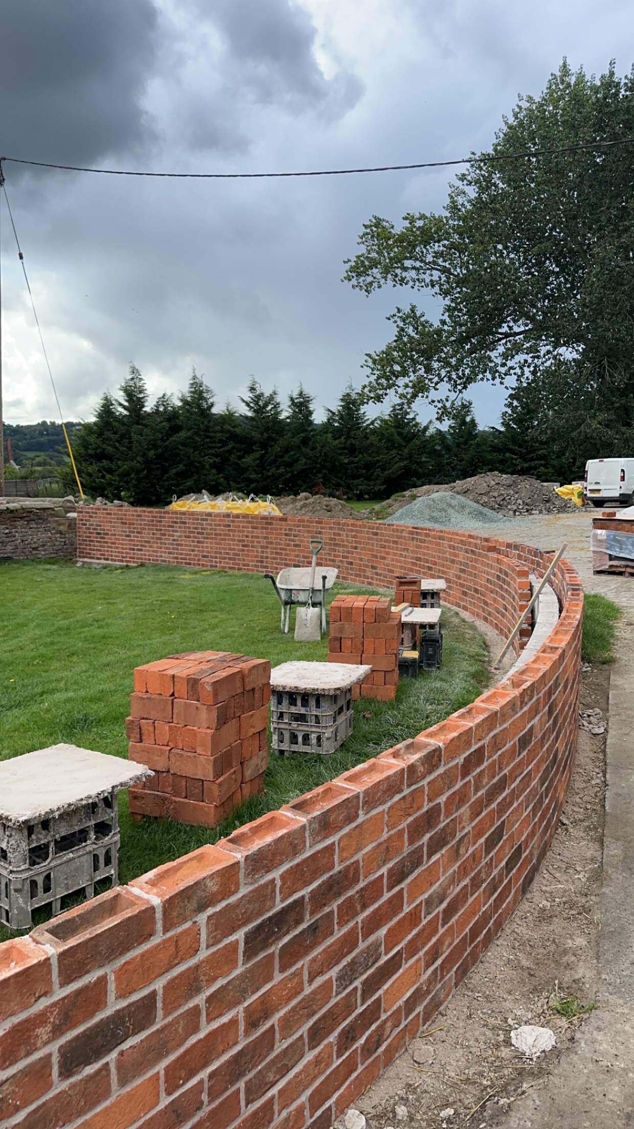 Curved garden wall during the brickwork stage