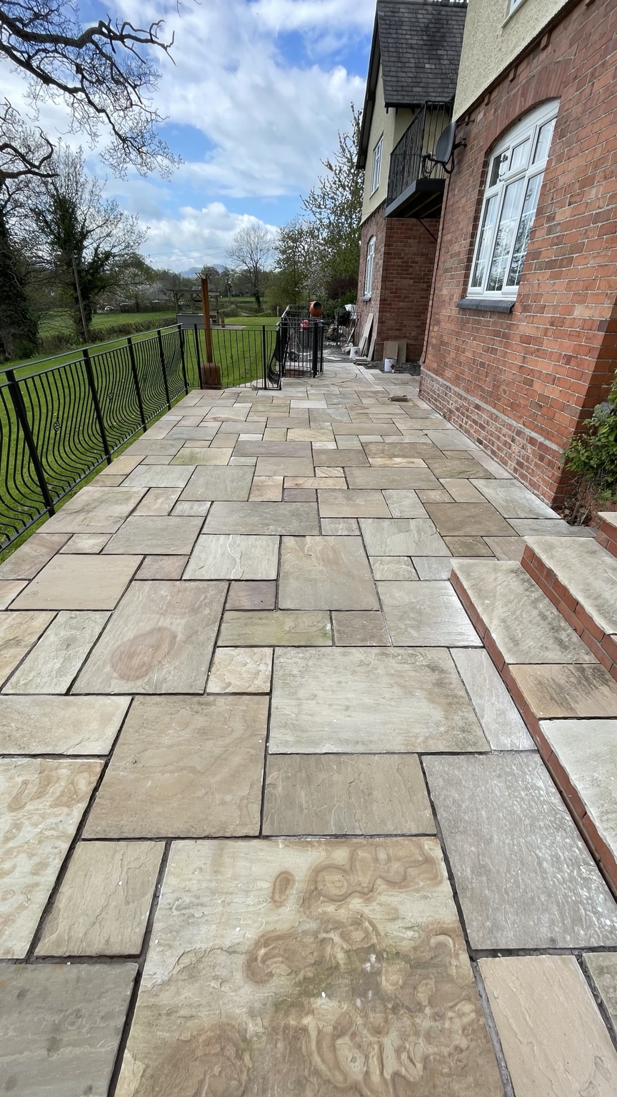 Indian sandstone patio laid along a house terrace
