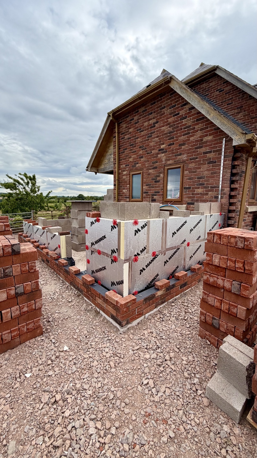Insulated cavity walls and external brickwork in progress